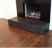 small cutout of concrete fireplace surround