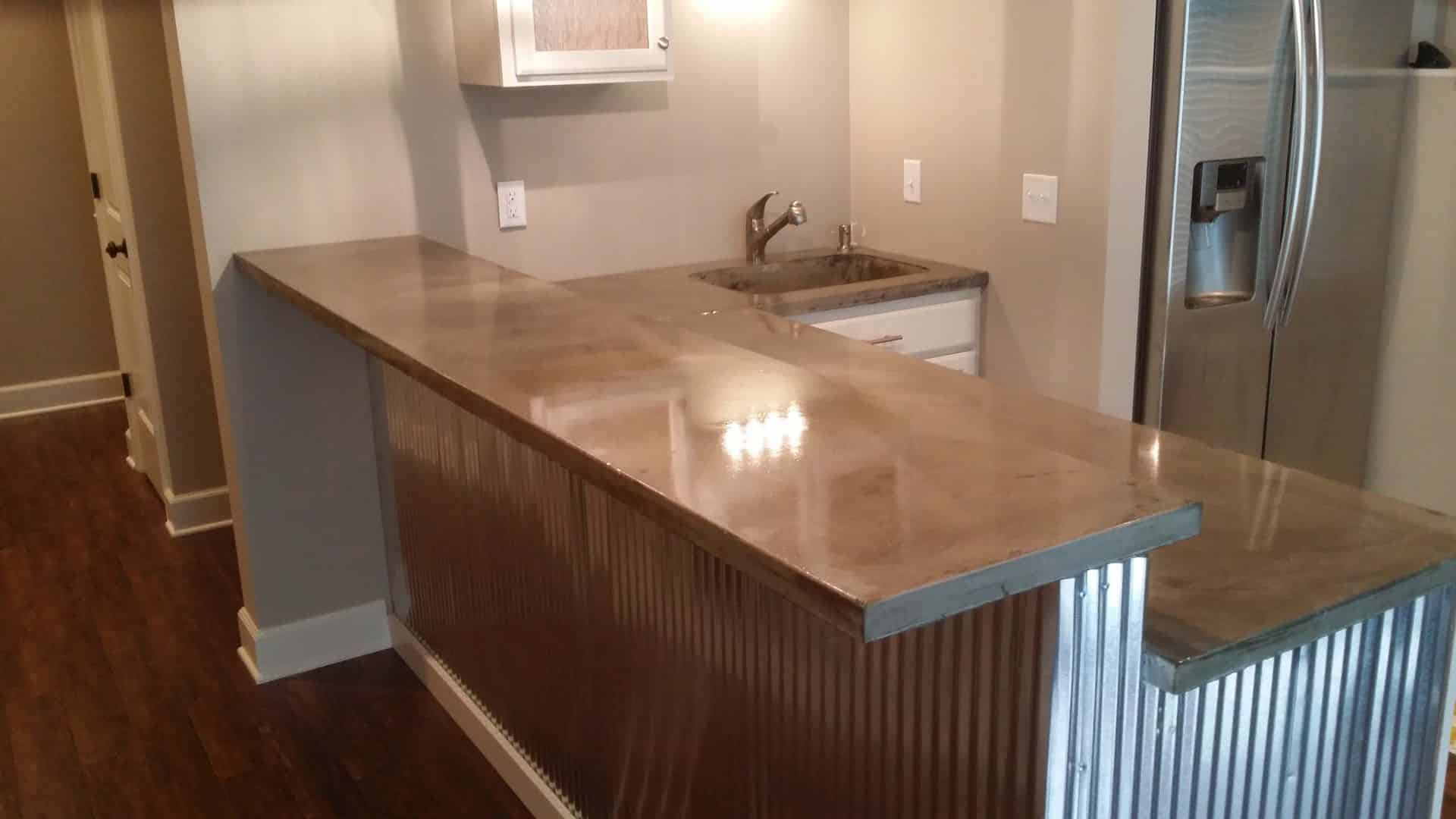 two level, shiny, kitchen bar top made of concrete