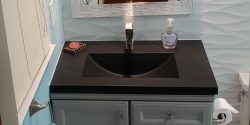 dark gray concrete barrel large basin in bathroom