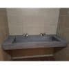 concrete double ramp faucet in commercial space