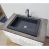 concrete vessel sink installed in single cabinet