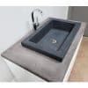 gray concrete vessel sink with fancy faucet