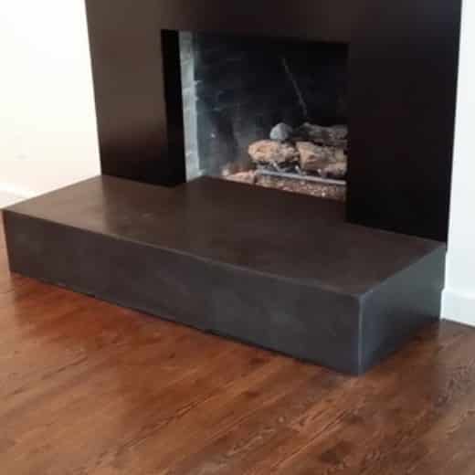 installed concrete fireplace surround